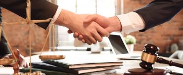 Client and lawyer shaking hands.